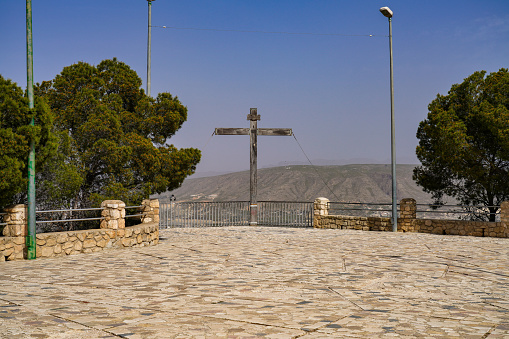 Famous cross at La Virgen del Buen Suceso Sanctuary in Cieza in Murcia region, Spain with view over the town Cieza