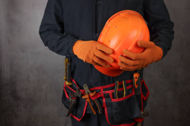 istock construction worker in a belt with tools and a helmet in hand 1311990838