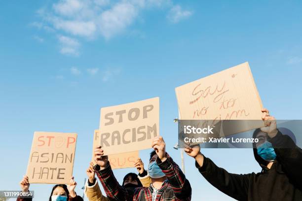 Asian People Protest On The Street Against Racism Group Of Multiracial Demonstrators From Different Asian Countries Fight For Equal Rights Stock Photo - Download Image Now