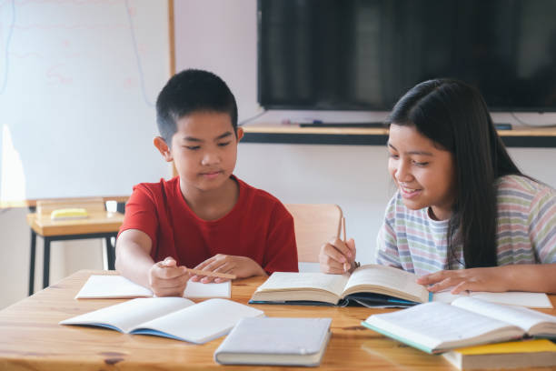 istock Two primary school kids learning together. 1311991486