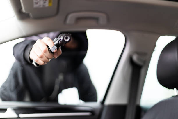 istock Villain with a gun threatened driver 1311992661