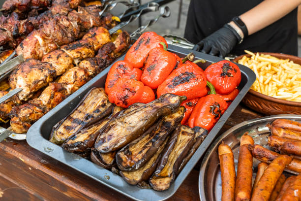 istock cooked grilled vegetables with sausages and grilled meat 1311993154