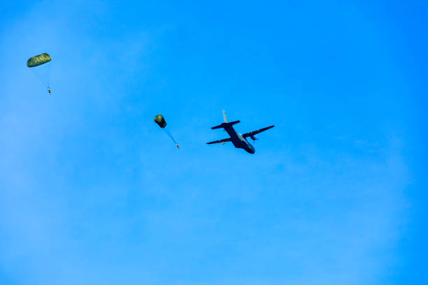 Soldiers jumps from military airplane at the training.