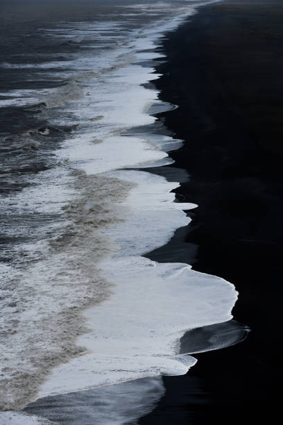istock Where the black land meets white water 1311993387