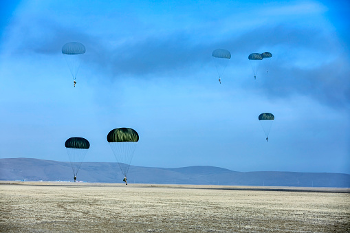 Soldiers jumps from military airplane at the training.