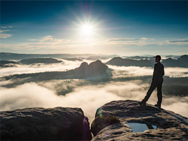 istock Winterberg daybreak view. Unique sandstone cliffs and deep misty valley 1311995564
