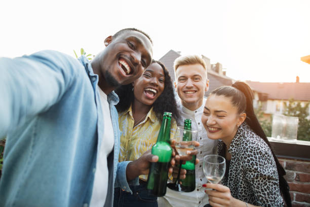 istock Joyful multicultural friends taking selfie on smartphone 1311996777