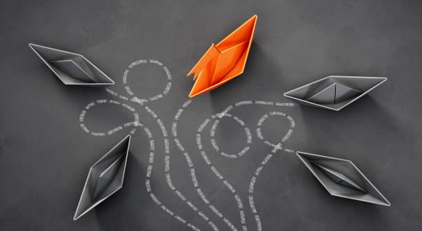 istock Paper boats - Thinking concept differently - Changing course - new ideas 1311996936
