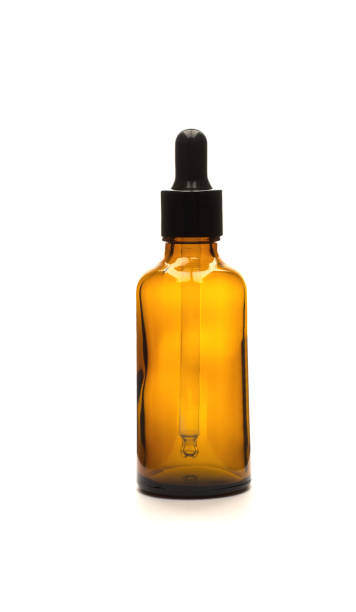 istock Brown bottle with dropper for essential oils on white background, isolate 1311997769