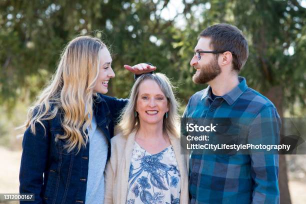 Comparing Their Height To Their Mother Stock Photo - Download Image Now - Short Person, High Up, Women