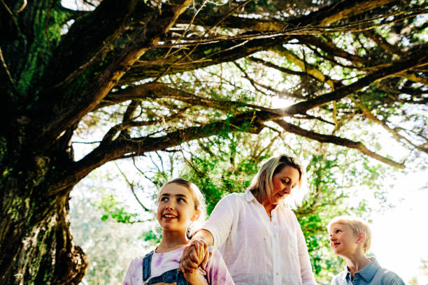 istock Family having fun playing in a forrest 1312002547