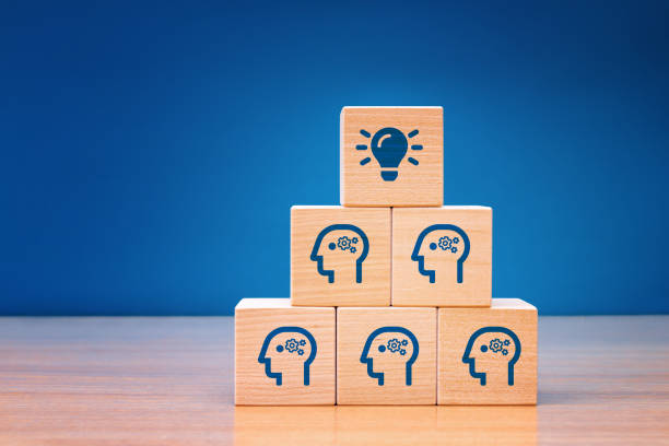 istock Wooden cube block with head human symbol and light bulb icon. Teamwork it's an easy way to resolve problem. Concept creative idea. 1312003547