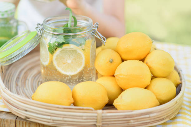 istock Plate with ripe fresh lemons and lemonade. Vitamins concept 1312003873