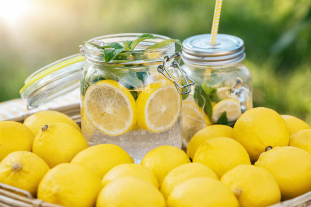 istock Plate with ripe fresh lemons and lemonade. Vitamins concept 1312003938