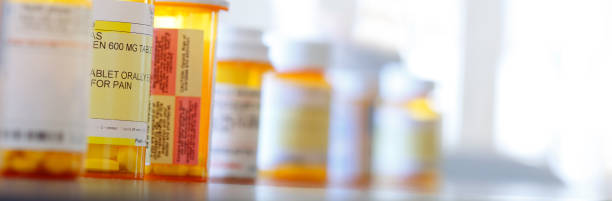 istock Row Of Various Pill Bottles 1312005887