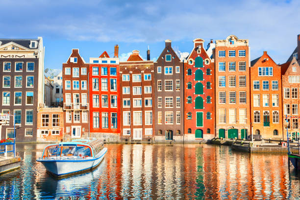 Houses in Amsterdam Typical dutch houses in Amsterdam, Netherlands canal house photos stock pictures, royalty-free photos & images