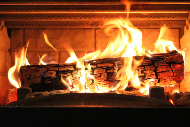 istock Closeup of a log burning in a fireplace 1312011083