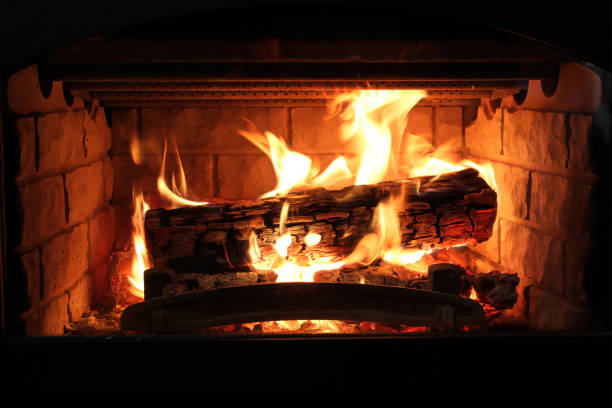 istock Closeup of a log burning in a fireplace 1312011084
