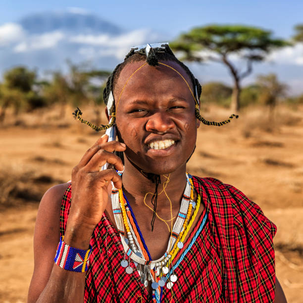 istock Warrior from Maasai tribe using mobile phone, Kenya, Africa 1312012403