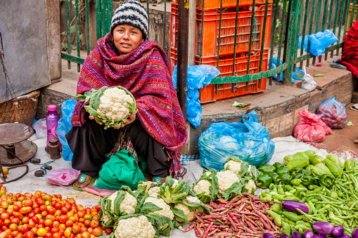 Nepali street  seller selling vegetables on the streets of Kathmandu, Nepal.