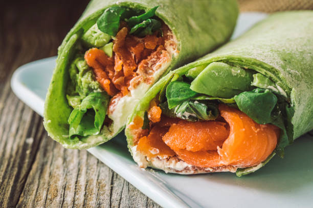 Salmon wrap with vegetables close up