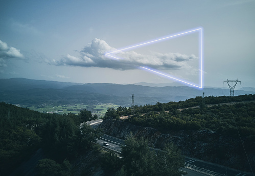 Mountain road top view, stunning triangle shape inside clouds made with neon light