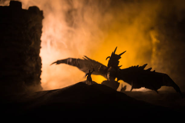 istock Battle between dragon and heroic soldiers. Creative table decoration. Selective focus 1312015990