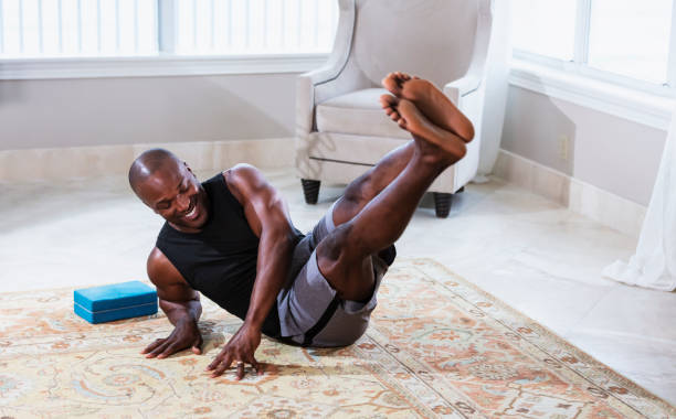 istock African-American man exercising at home 1312017882