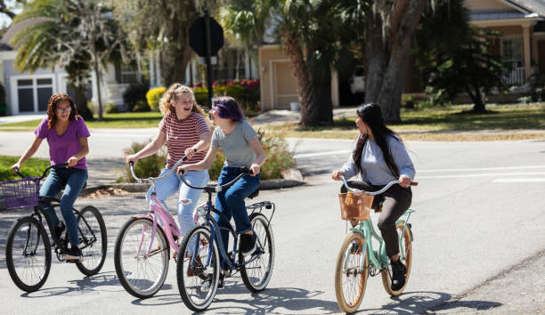 istock Four multi-ethnic tween girls riding bicycles 1312018732
