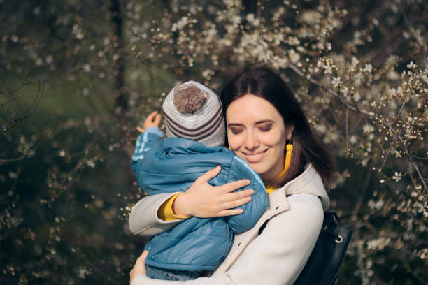 istock Happy Mother and Child in Blooming Spring Nature 1312019411