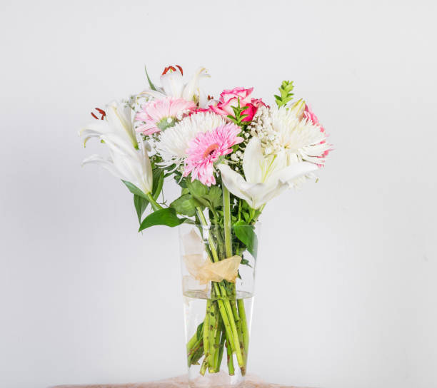 The portrait of beautiful decorating flowers in a glass.