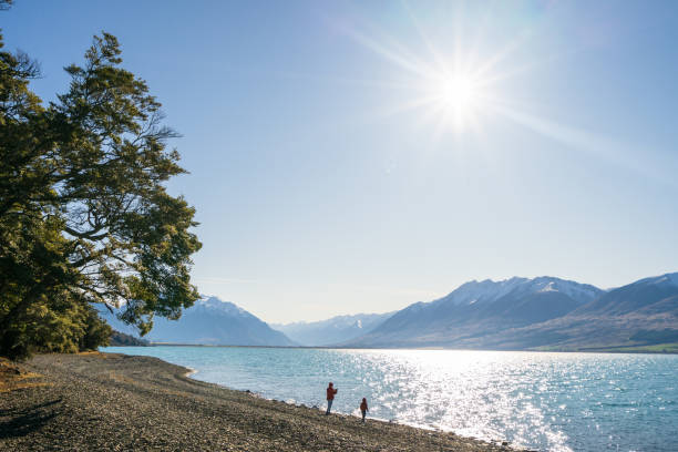 istock Mother and son enjoying lake view. 1312020378