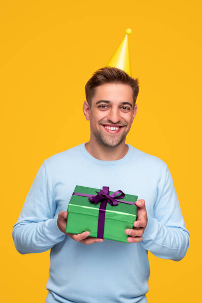 istock Happy man with birthday present 1312022133