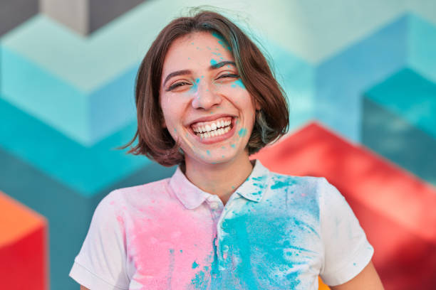 istock Laughing woman with paint on face 1312022176