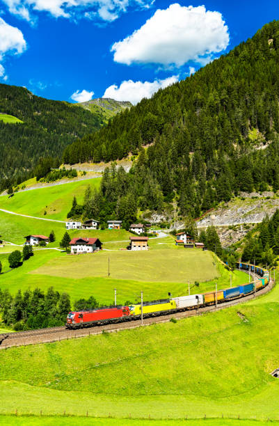 istock Trucks crossing the Alps by rail in Austria 1312022336
