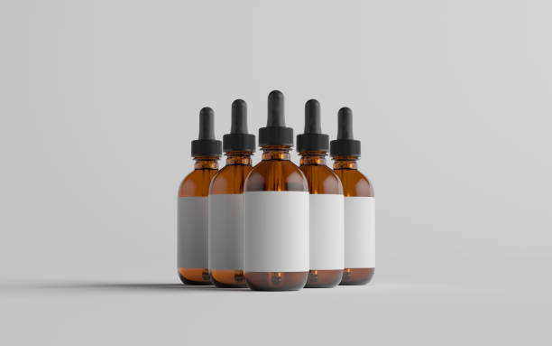 istock Amber Glass Dropper Bottle Mockup - Multiple Bottles. Blank Label 1312022471