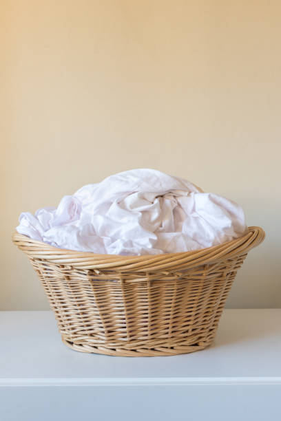 istock White laundry in wicker basket on shelf 1312026168