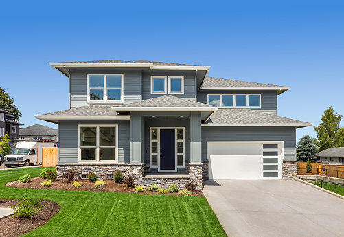 Facade of home with manicured lawn