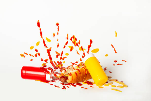istock Ketchup and mustard are splattered over a hotdog 1312032200