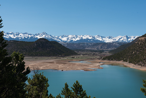 Ridgway Reservoir has very low water in this photo taken in early April before most of the snow has melted in the San Juan Mountains.