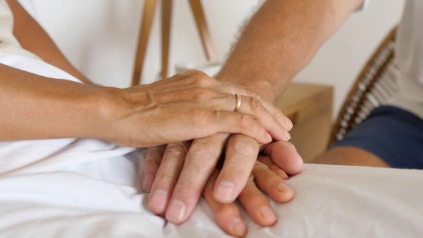 istock Staying a team till the end. Team hand stack of a senior couple 1312040543