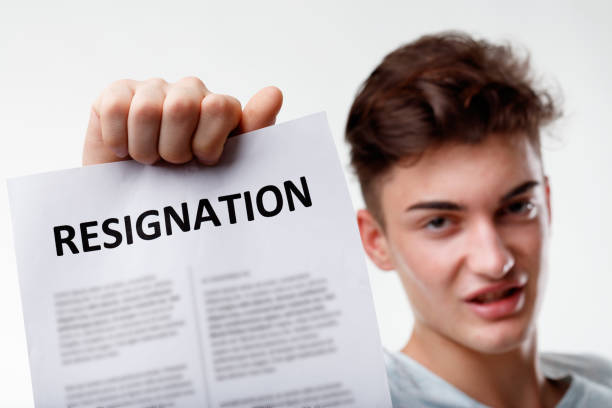 istock Young man holding up his Resignation letter with selective focus 1312041644