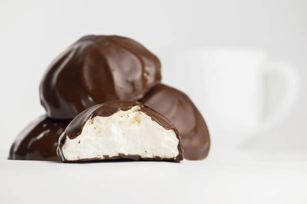 istock Close-up soft focus of chocolate covered marshmallow halves with blurred background. 1312042372