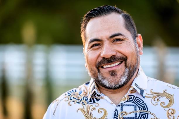 istock Smiling mature hispanic man looking at the camera 1312042465