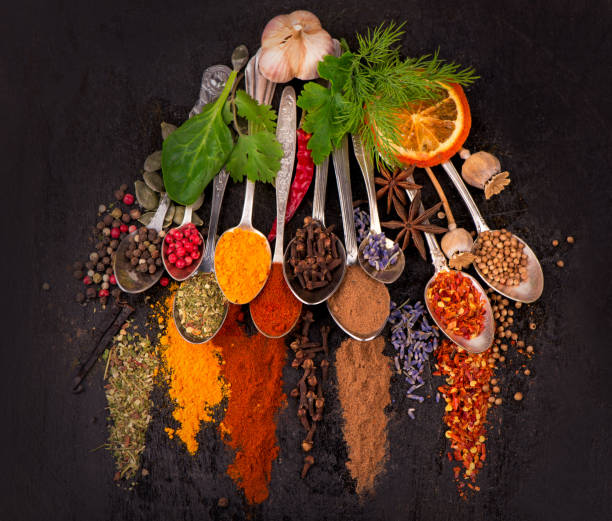 istock Spices and condiments for cooking on a black background 1312042565
