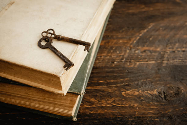 istock Old books and vintage keys. 1312042592