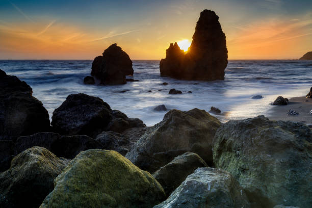 Sunbeam through sea stacks at Rodeo Beach Sunbeam through sea stacks at Rodeo Beach. Marin County, California, USA. marin county stock pictures, royalty-free photos & images