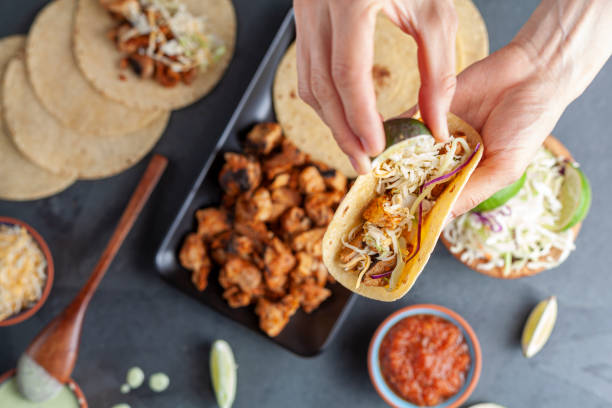 istock mexican taco with roasted chicken on corn tortillas with side dishes 1312047831
