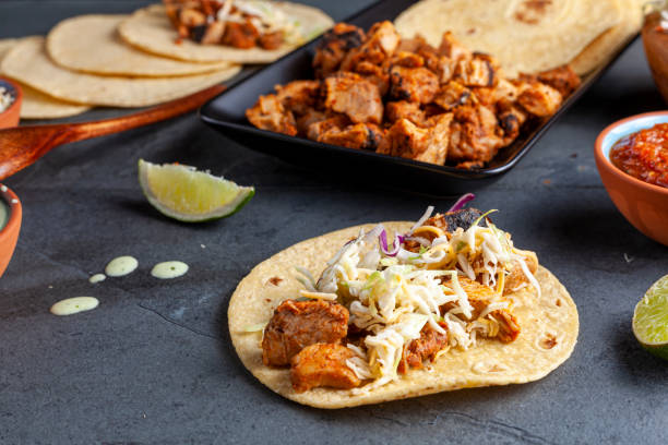 istock mexican taco with roasted chicken on corn tortillas with side dishes 1312047869