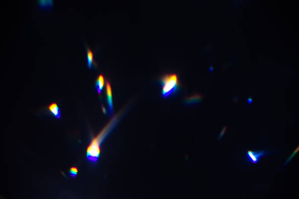 istock colorful warm rainbow crystal light leaks on black background 1312049960